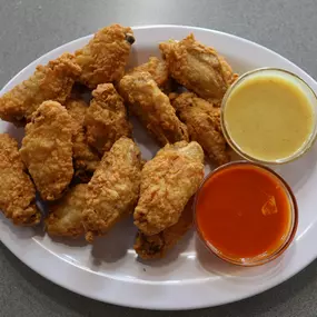 Breaded chicken wings with dipper sauce