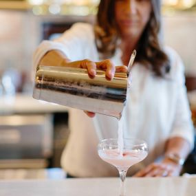 Bartender pouring cocktail Iron Works
