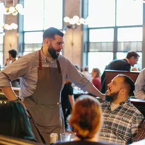 Server at table Iron Works