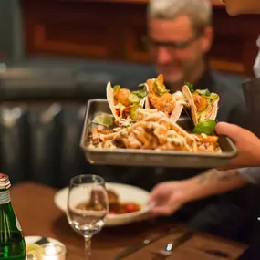 Tacos being delivered at Iron Works