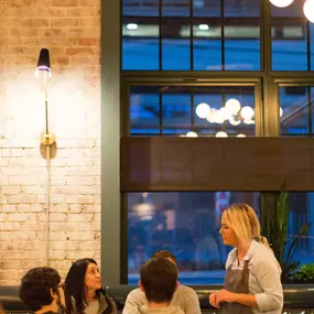 Server at table at Iron Works