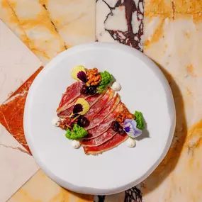 Chef’s Signature: Duck ham with smoked walnuts, sweet and sour blueberries and crème fraîche
