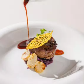 Chef’s Signature: Beef fillet with purple cabbage, white baby turnips, mustard crisp
and chicken giblet sauce