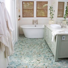 Pebble tile mosaics add a natural touch to spaces in your home including backsplashes, floors, and walls. Each organically shaped stone is selected to fit perfectly together to create an indoor oasis. Pebble stone tiles are available as raised or flat pebbles, polished or rough surface textures and in a variety of colors.