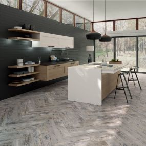 Wood look porcelain tile is a stylish and convenient material that mimics the natural feel, appearance and texture of real hardwood. It is easy to clean, maintain and is a compliment to any home design style you are interested in. It is also available in a wide assortment of colors, sizes and patterns. It is best used as a decorative wall accent or as an alternative for actual wood flooring that is sure to add charm and warmth to your space.