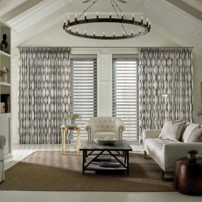 Add a finishing touch to frame and elongate your windows with Hunter Douglas side panels and drapery. Hunter Douglas offers a carefully curated collection of fabrics to add drama, texture and dimension to your room. They layer beautifully with any other window treatment, while also helping to control unwanted light gaps.