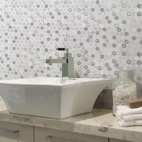 Glass tile offers a unique visual appeal and is available in a wide array of shapes, shades and finishes, making design options virtually limitless. Glass tile is known to naturally reflect light which can make rooms seem brighter and adds depth to your space.