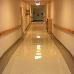 This hospital corridor was sanitized to medical-grade standards by Dallas Janitorial Services, featuring gleaming floors and disinfected surfaces. Our healthcare facility cleaning ensures safe passage for patients, visitors, and medical staff.