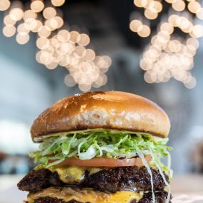 House Burger- two 4oz patties, American cheese, caramelized onion, HQ sauce, lettuce, tomato