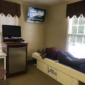 Patient receiving Treatment with Levinson Chiropractic Vax D Spinal Decompression Table