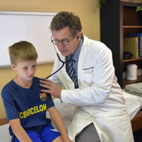 Dr. Holst caring for patient at the clinic in Sheridan, WY