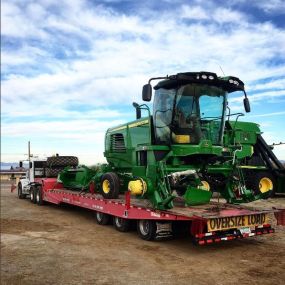 John Deere Tractor loaded on a semi-bed outside RDO Equipment Co. - Ehrenberg, AZ