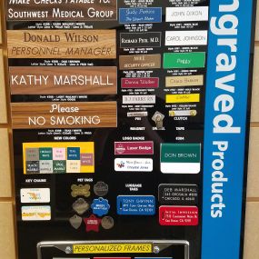 Engraved products including: name badges, name plates, pet tags, and license plate frames.