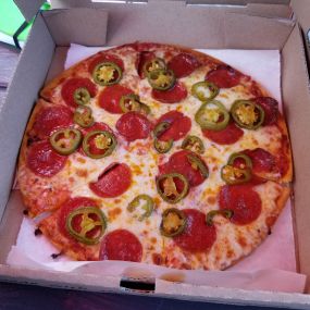 Try a delicious thin crust pepperoni and jalapeno pizza! One of our fan favorites, this pizza is packed with flavor and simmering with some heat!