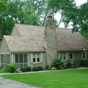 Here is a Cedar Shake Roof that we've put on in the past. We love this unique look to houses that make them stand out!