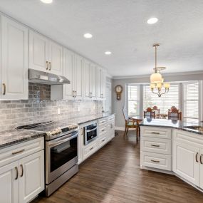 Steel Grey Granite countertops, KCD Napa White  Soft Close cabinets with Melamine interior