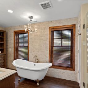 New tub, chandelier, flooring, cabinets, countertops, wall tile