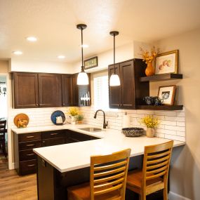 New cabinetry, subway backsplash tile, new countertops, new pendants