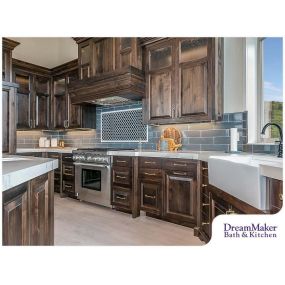 These cabinet colors blend perfectly with the beautiful grey and blue shades in this kitchen! Call today to learn more about our kitchen remodeling process.