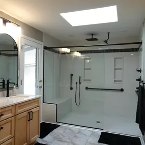 8 ft. Custom Onyx Shower with tile accent, bench, and grab bars.