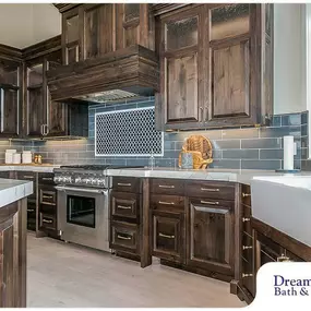 These cabinet colors blend perfectly with the beautiful grey and blue shades in this kitchen! Call today to learn more about our kitchen remodeling process.