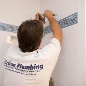 Outer Banks NC plumber repairing shower head and shower head installation.