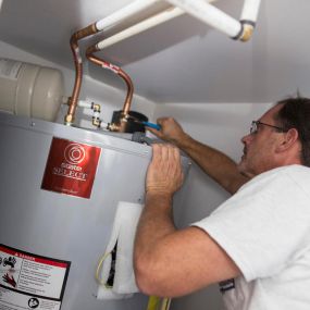 Outer Banks Plumbers doing a Water Heater Repair or Installation.