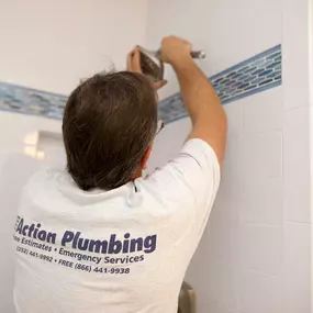 Outer Banks NC plumber repairing shower head and shower head installation.