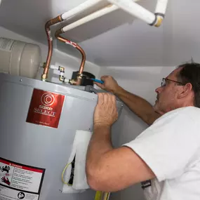 Outer Banks Plumbers doing a Water Heater Repair or Installation.