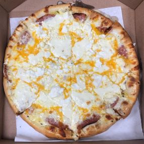 Are you a cheese lover? Order our 6th Sense Pizza! Sprinkled with fresh Genoa Salami and Pepperoni and then piled high with cheddar, feta, fresh mozzarella, shredded mozzarella, goat cheese, pecorino romano and ricotta cheese!
