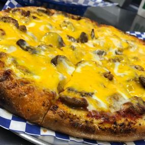 Give our Hand-Tossed Sausagefest pizza a try! Made with fresh sliced Italian Sausage, sliced meatballs, bacon and tons of cheeese!