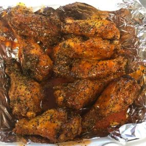 Crispy wings fried to perfection covered in spicy lemon pepper sauce! Just one of our many signature sauces!