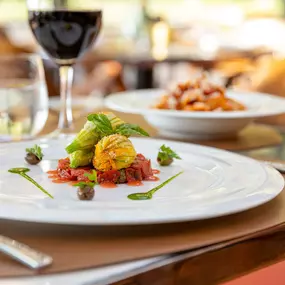 Courgette blossoms stuffed with ricotta and taleggio, with black olives and cherry tomatoes is the signature dish of Hotel Eden