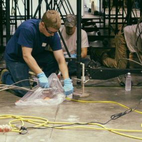 Uretek technicians performing Pressed Pilings technique for foundation repair