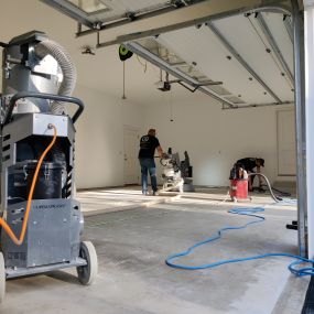 garage surface being prepared with diamond grinder