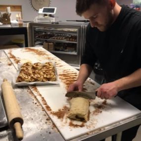 Aaron Pound Preparing Fresh Baked Cinnamon Rolls- Every Morning!