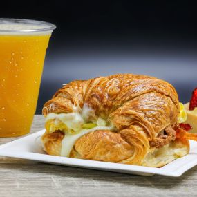 Breakfast Croissant and Passion Fruit Smoothie with a Tropical Basket