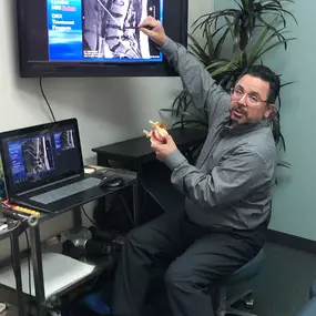 Dr. Prieto at Prieto Chiropractic & Spinal Decompression Center in Northern Orange County, reviewing a spine xray.