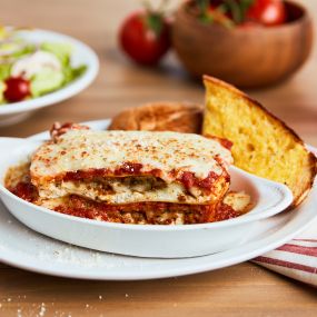 LASAGNA - Always a classic! Layers of seasoned ricotta, mozzarella, sliced meatballs & crumbled sausage baked in our marinara sauce.