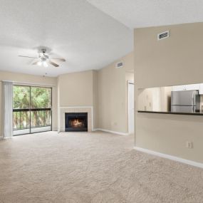 Living room with fireplace and patio access