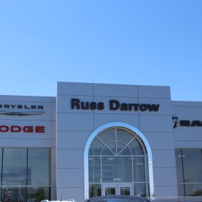 Russ Darrow Metro Chrysler Dodge Jeep RAM front of building.