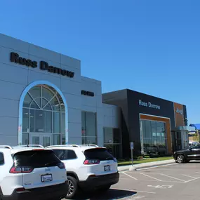 Russ Darrow Metro Chrysler Dodge Jeep RAM front of building.