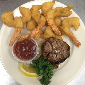 Our juicy, delicious Petit Filet Steak and Jumbo Shrimp dinner comes with fresh-cut fried zucchini, pasta sampler, your choice of potato or vegetable and bread with butter. It has long been a customer favorite and it’s easy to see why!